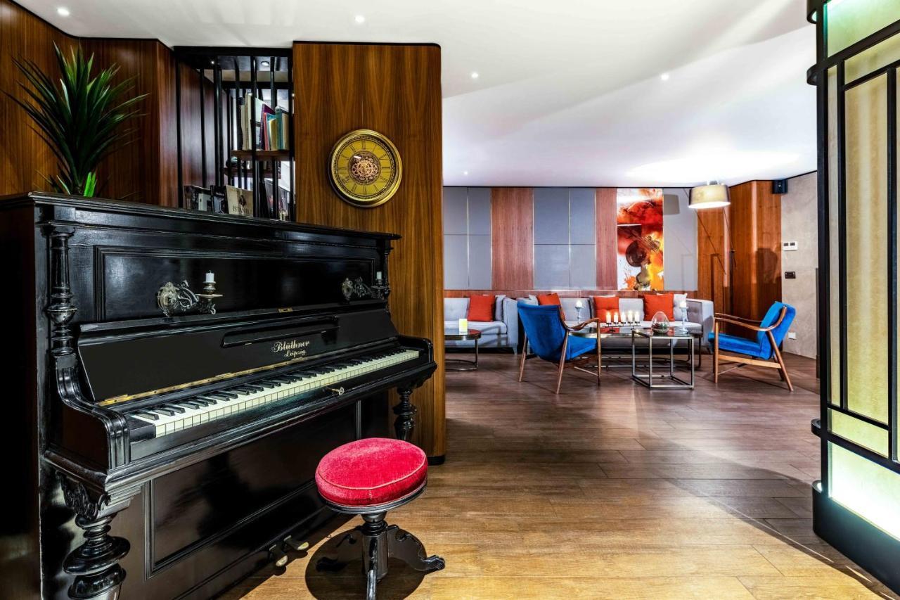 イスタンブール Tzl スイーツアパートホテル エクステリア 写真 The piano in the lounge