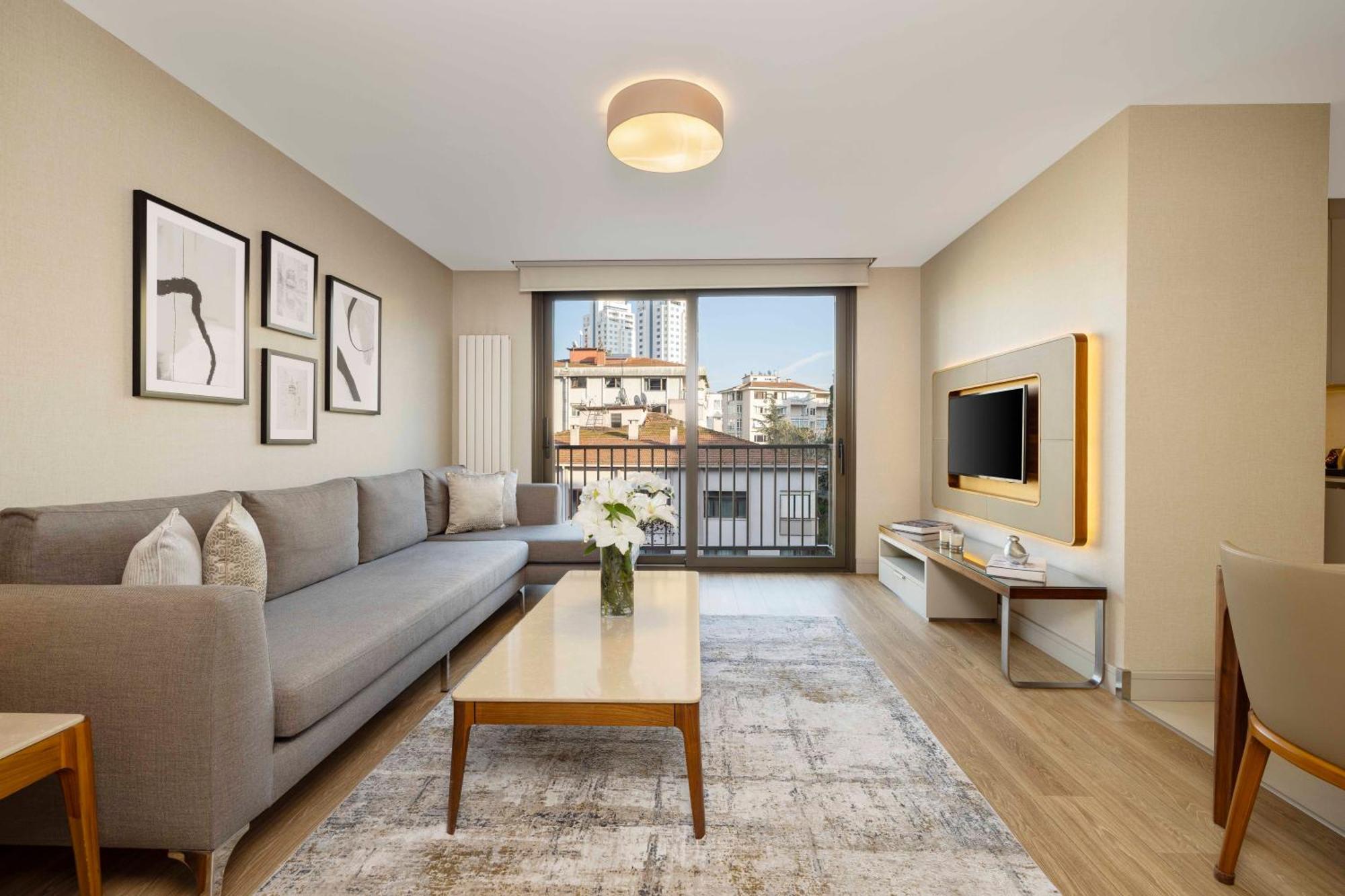 イスタンブール Tzl スイーツアパートホテル エクステリア 写真 A staged living room