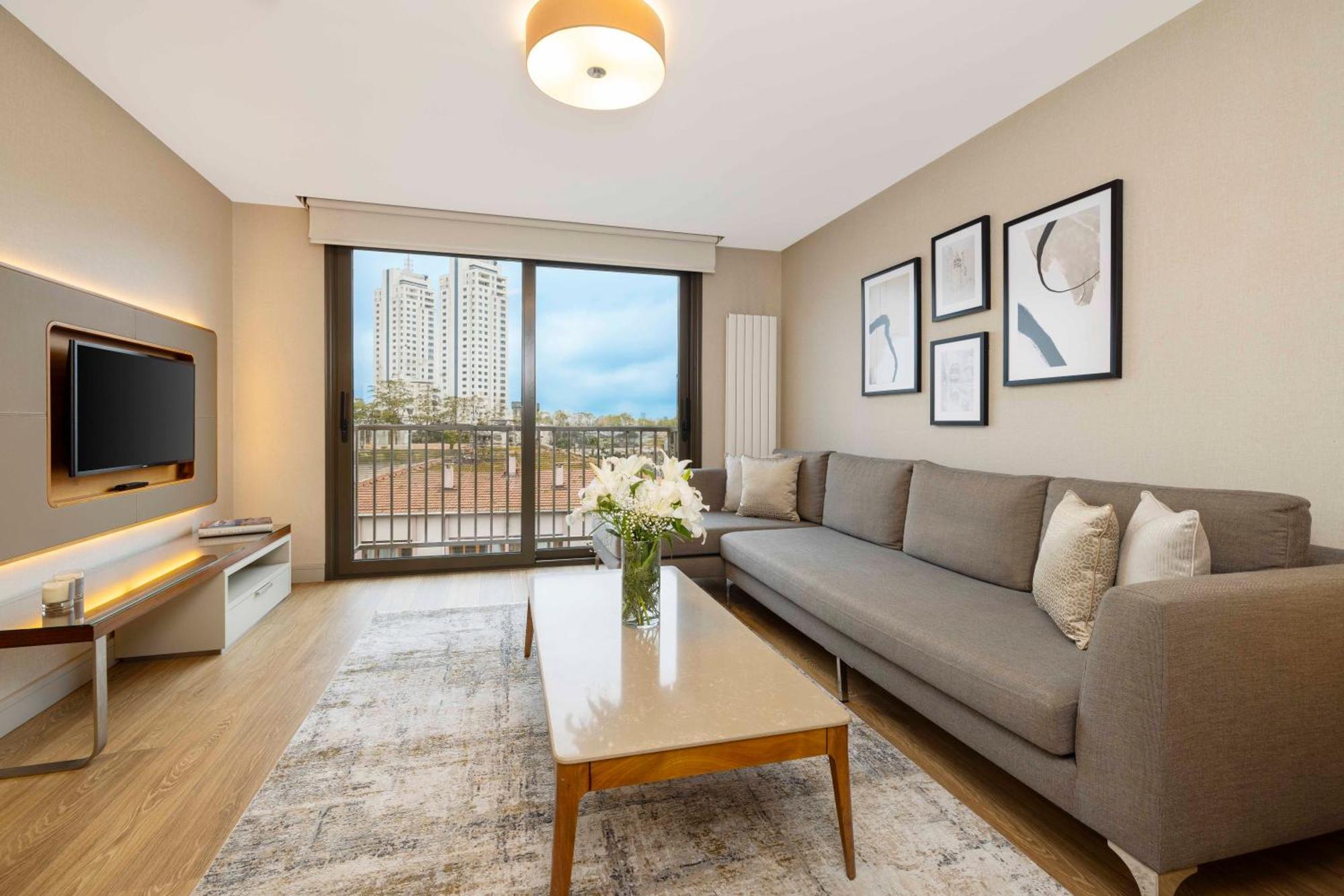 イスタンブール Tzl スイーツアパートホテル エクステリア 写真 A staged living room